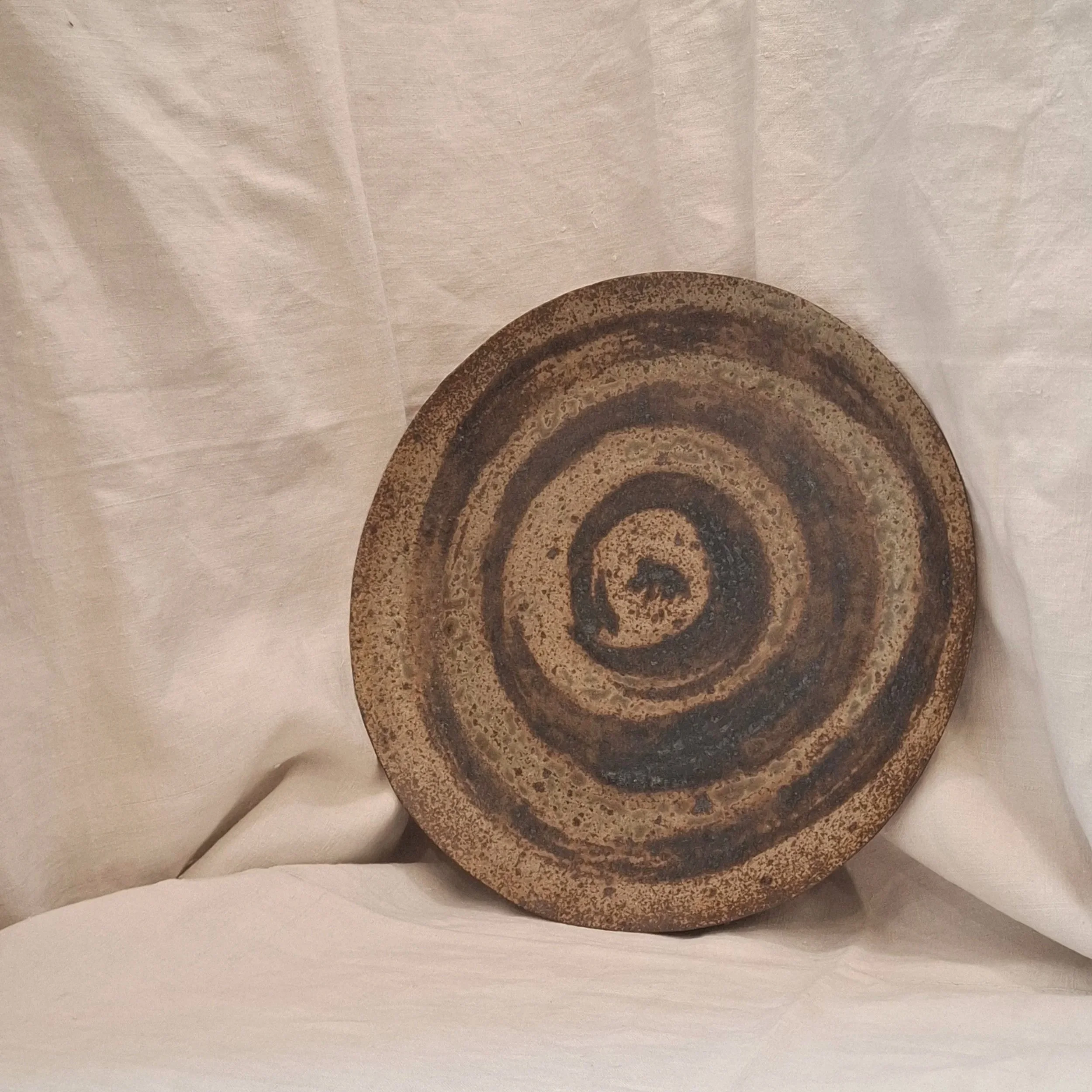 Brown green spiral glazed stoneware plate by Miguel Neto