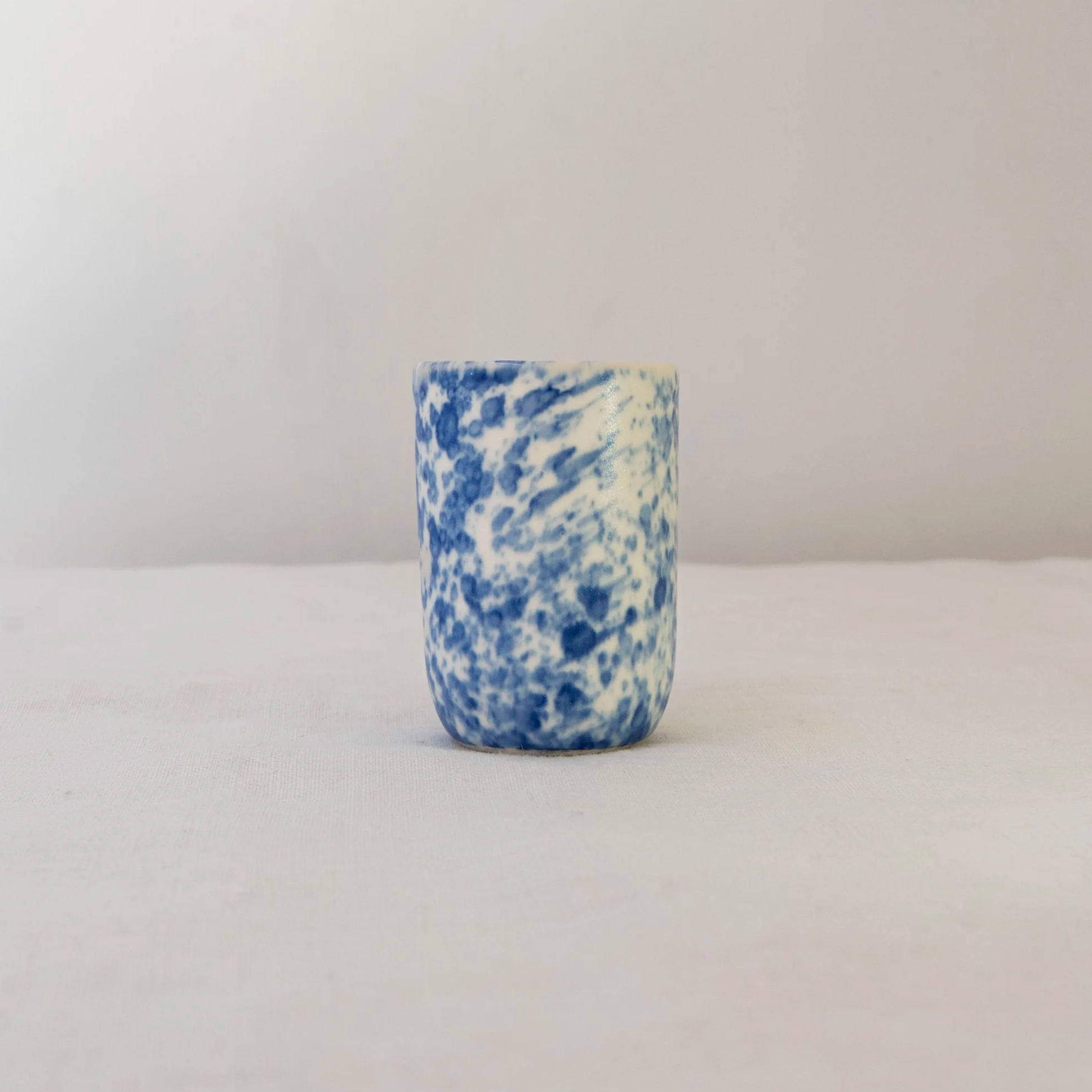 Small cup with blue speckled glaze, by Desvio Ceramics