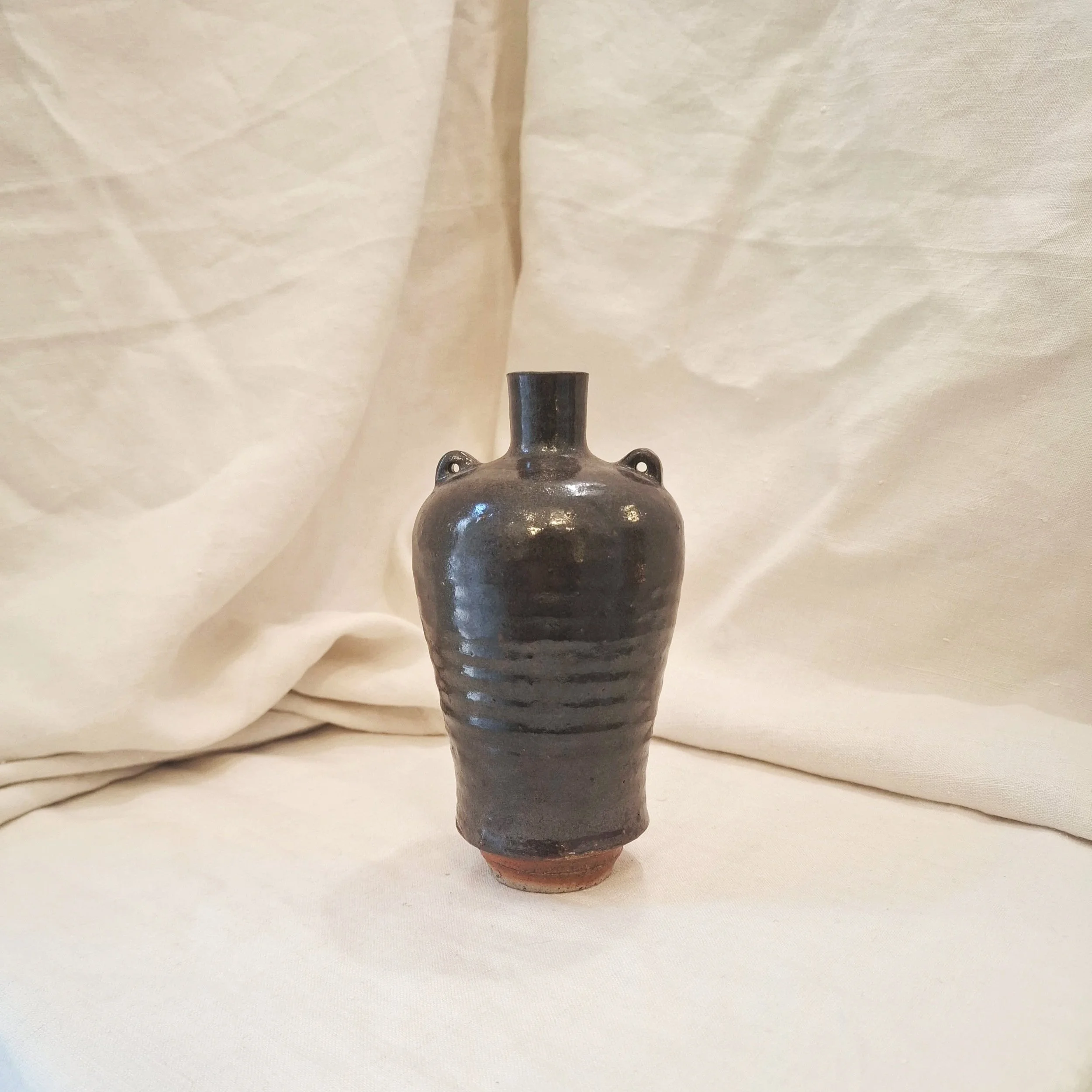 Dark copper glazed stoneware vase by Miguel Neto