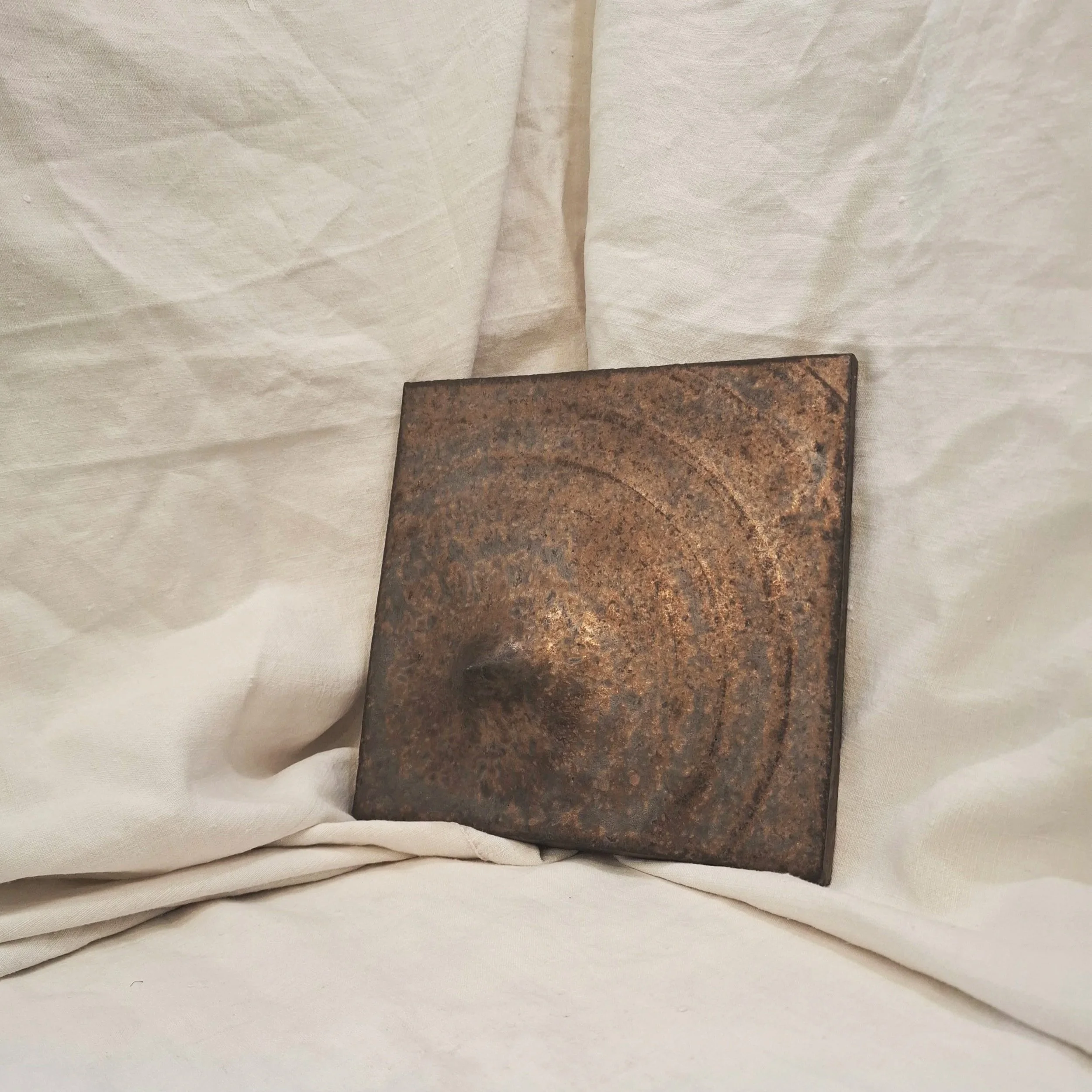 Copper glazed stoneware plate by Miguel Neto