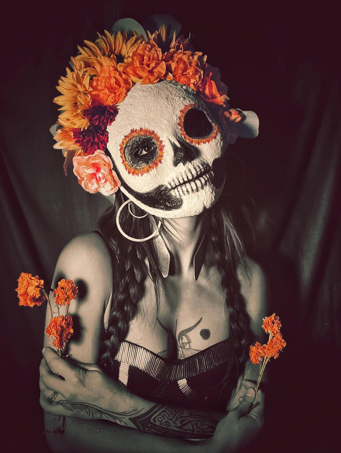 Calavera (2023), paper-mache, silk flowers