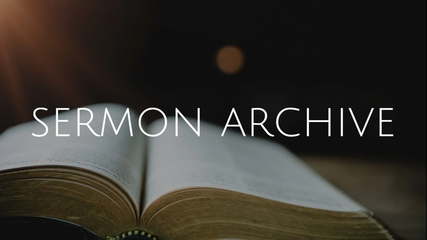 Open Bible with the words "Sermon Archive" overlayed, dark background
