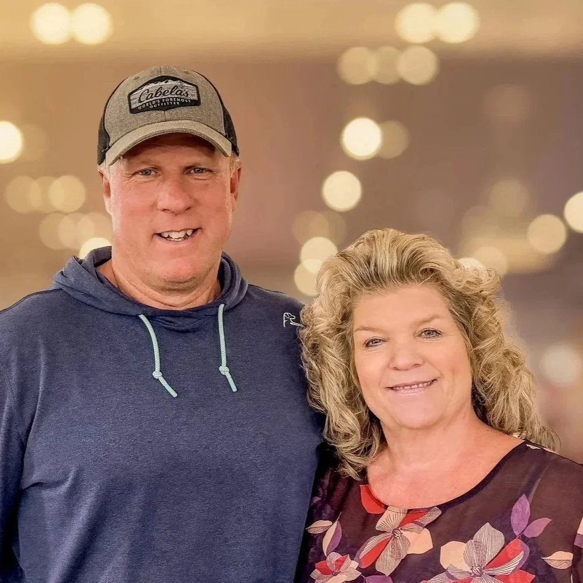 Blurred background with the words 'NEW GROUP' in bold and outlined text.