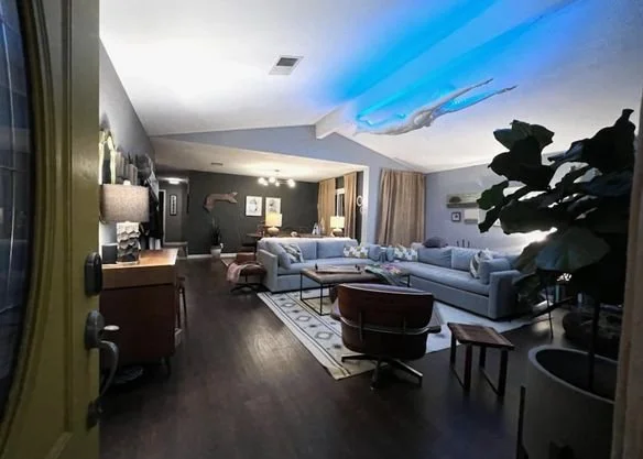 Finished living room remodel with load bearing wall removal by an Austin home remodeling contractor