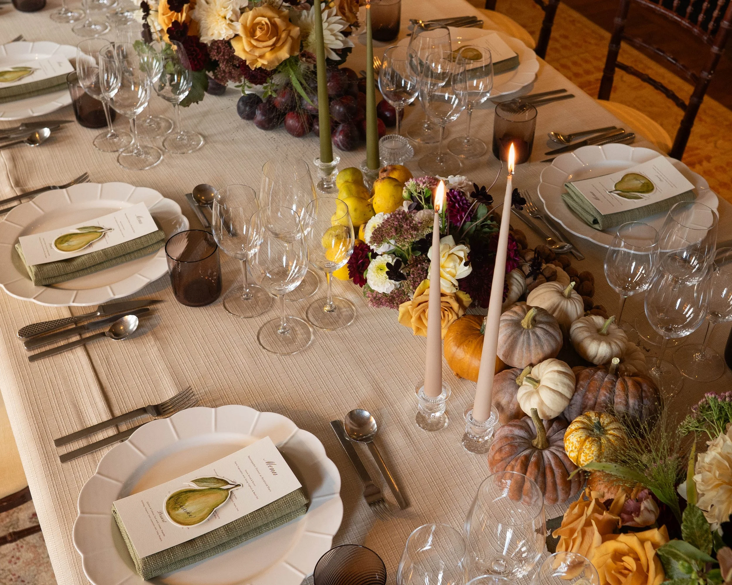 Autumnal produce fruit and flowers tablescape