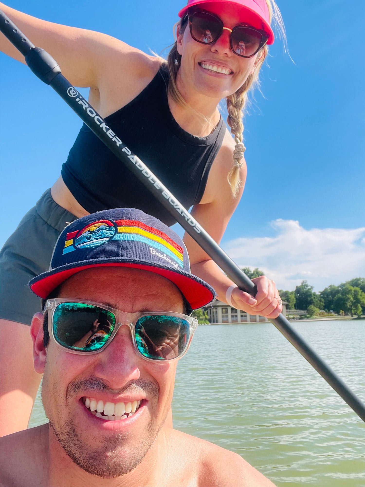 Gina Fidler and husband taking a selfie while paddle boarding | Wash Park Health | Simple, Convenient, Personalized Healthcare in Wash Park, Denver