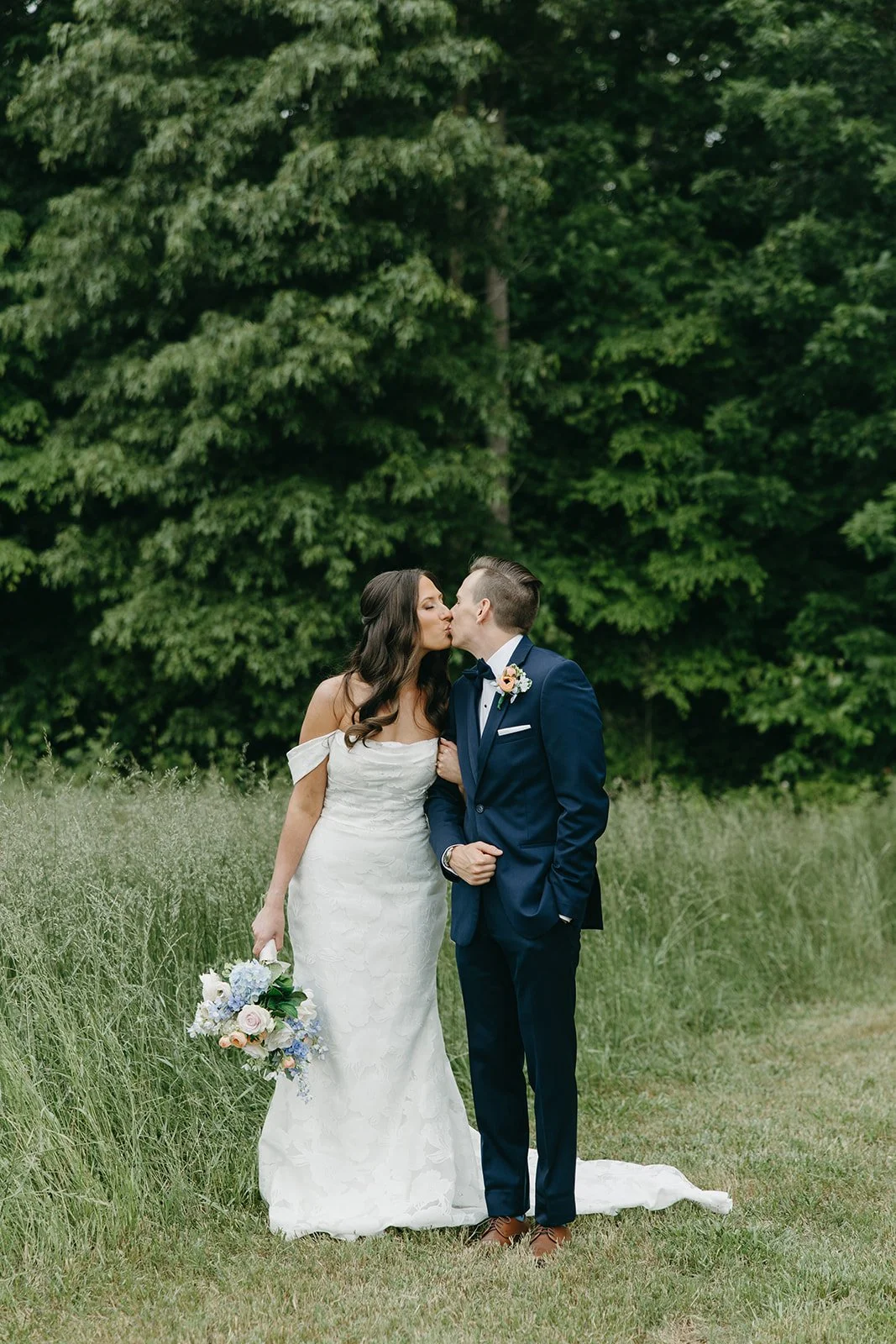 Outdoor ceremony at The Fields at Skycrest surrounded by spring florals and soft golden light.