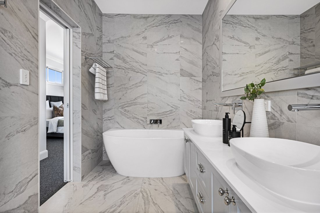 Ensuite Bathroom in Wavell Heights including marble floor and walls and double vanities.