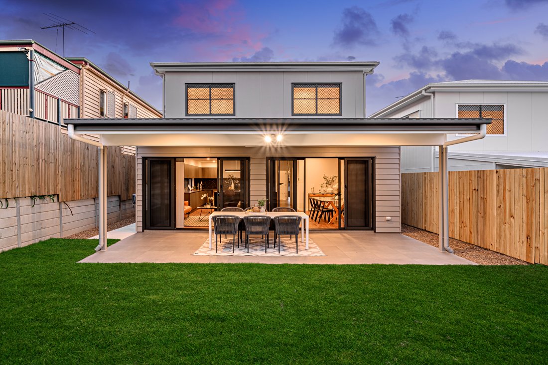 Stunning outdoor dining space with green grass looking toward the rear of Wavell Heights