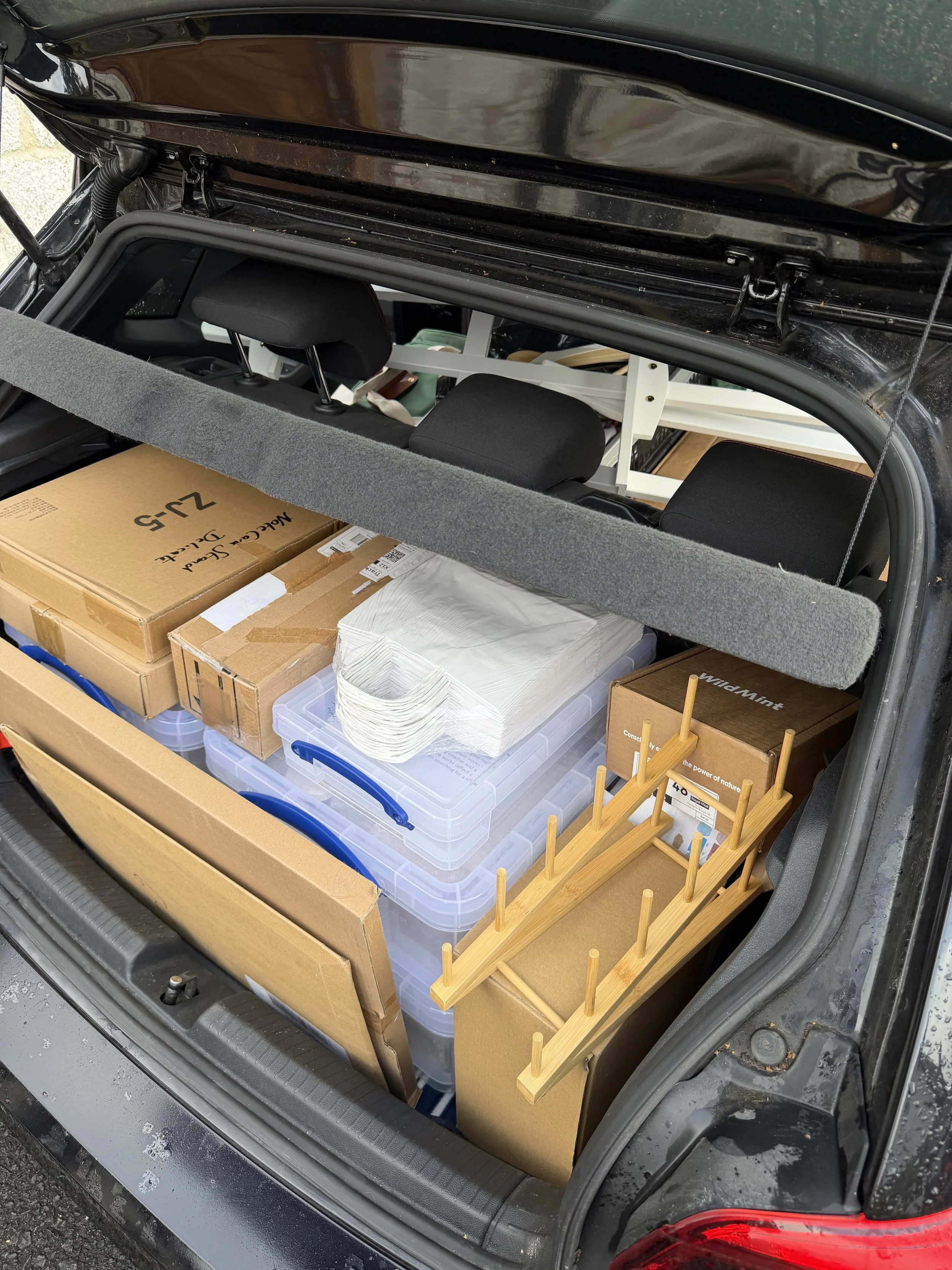 My car packed up with boxes and bags.