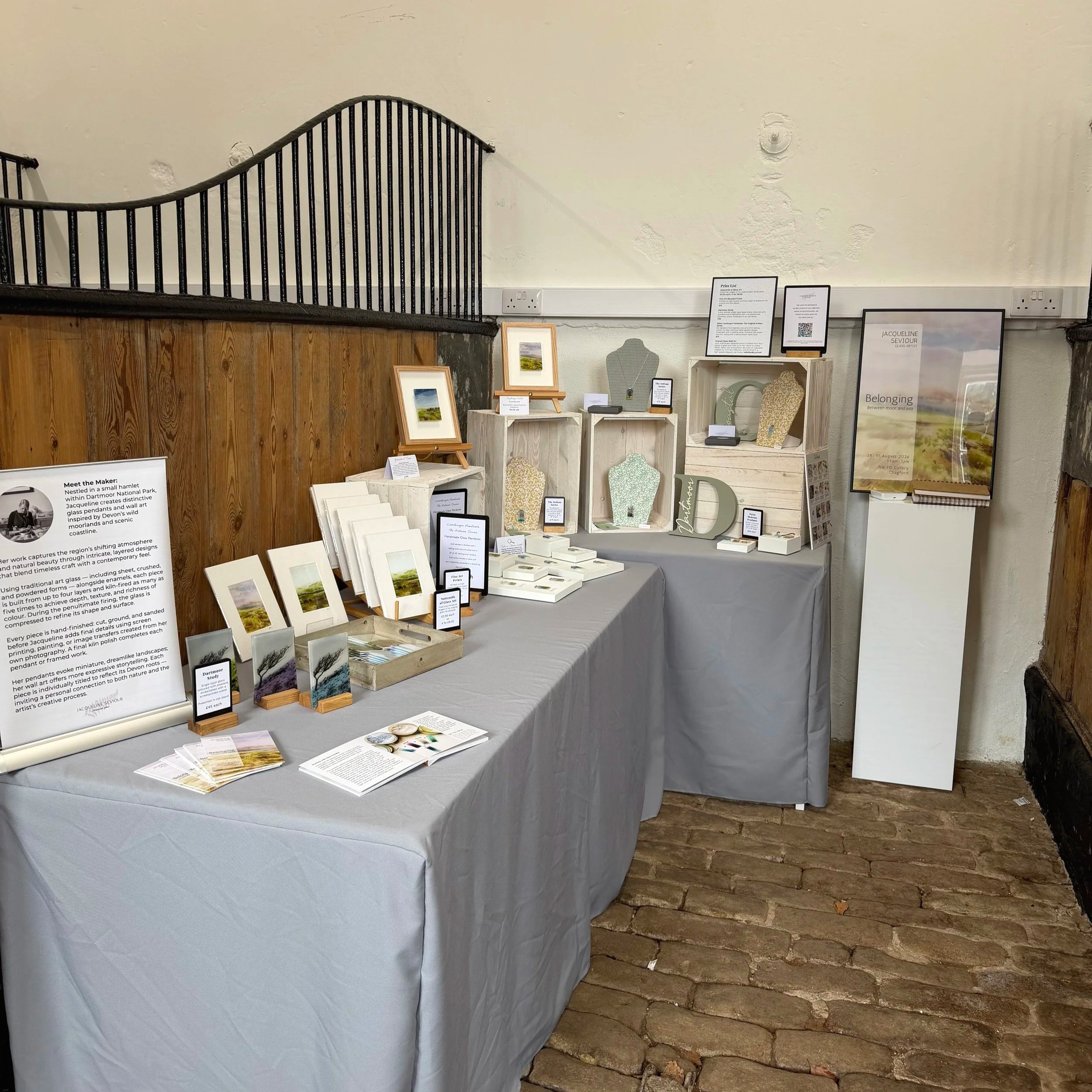 My art stand set up in a stable at an event.