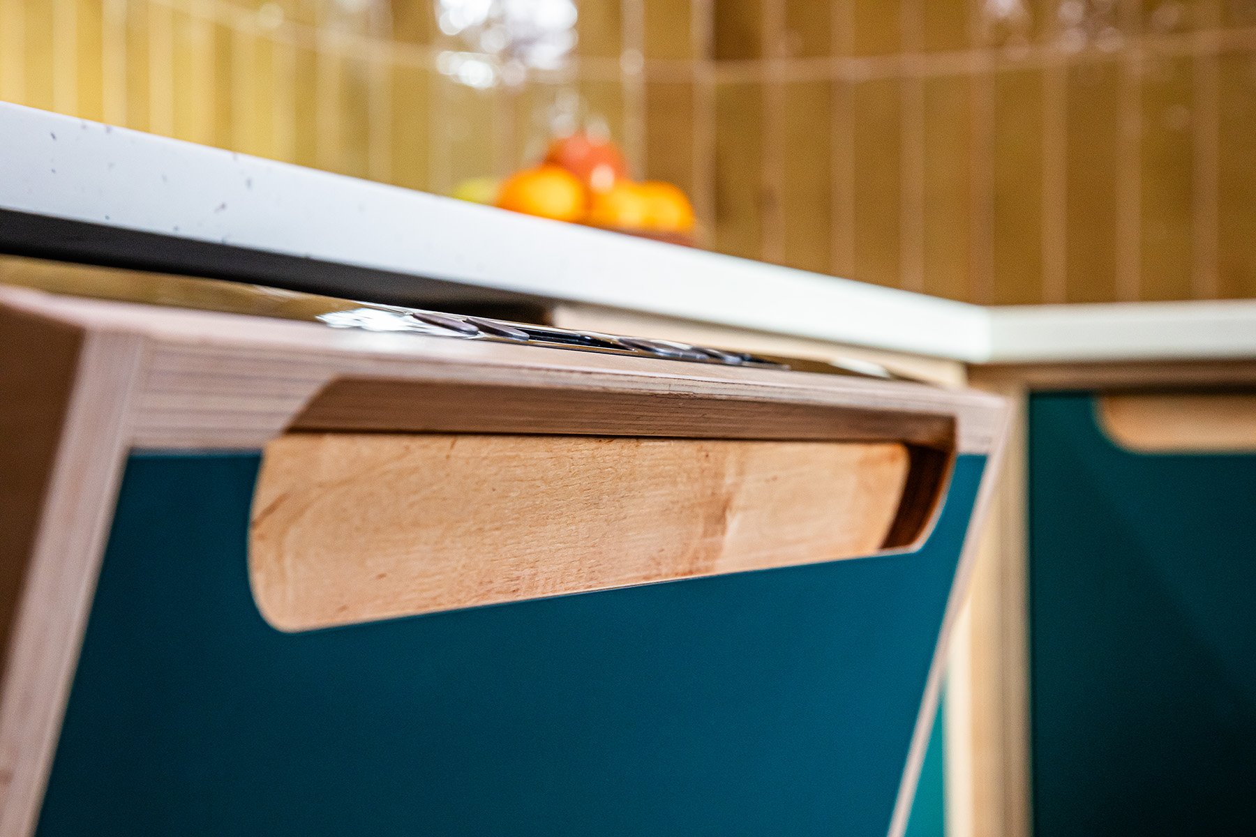 Have a look at this sleek plywood kitchen! Natural vibe and clean lines. The dishwasher door has the frame fixed directly to it, but the frame fouls the hand as the door drops down, so we added this chamfer to create the clearance. It&rsquo;s the lit