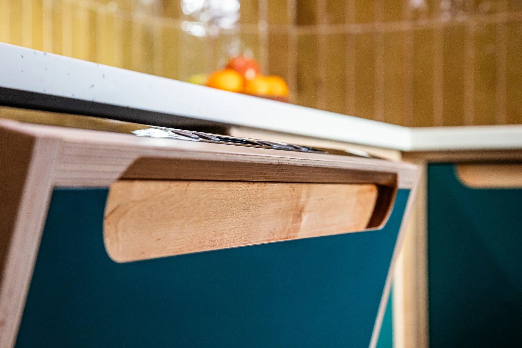 Have a look at this sleek plywood kitchen! Natural vibe and clean lines. The dishwasher door has the frame fixed directly to it, but the frame fouls the hand as the door drops down, so we added this chamfer to create the clearance. It&rsquo;s the lit