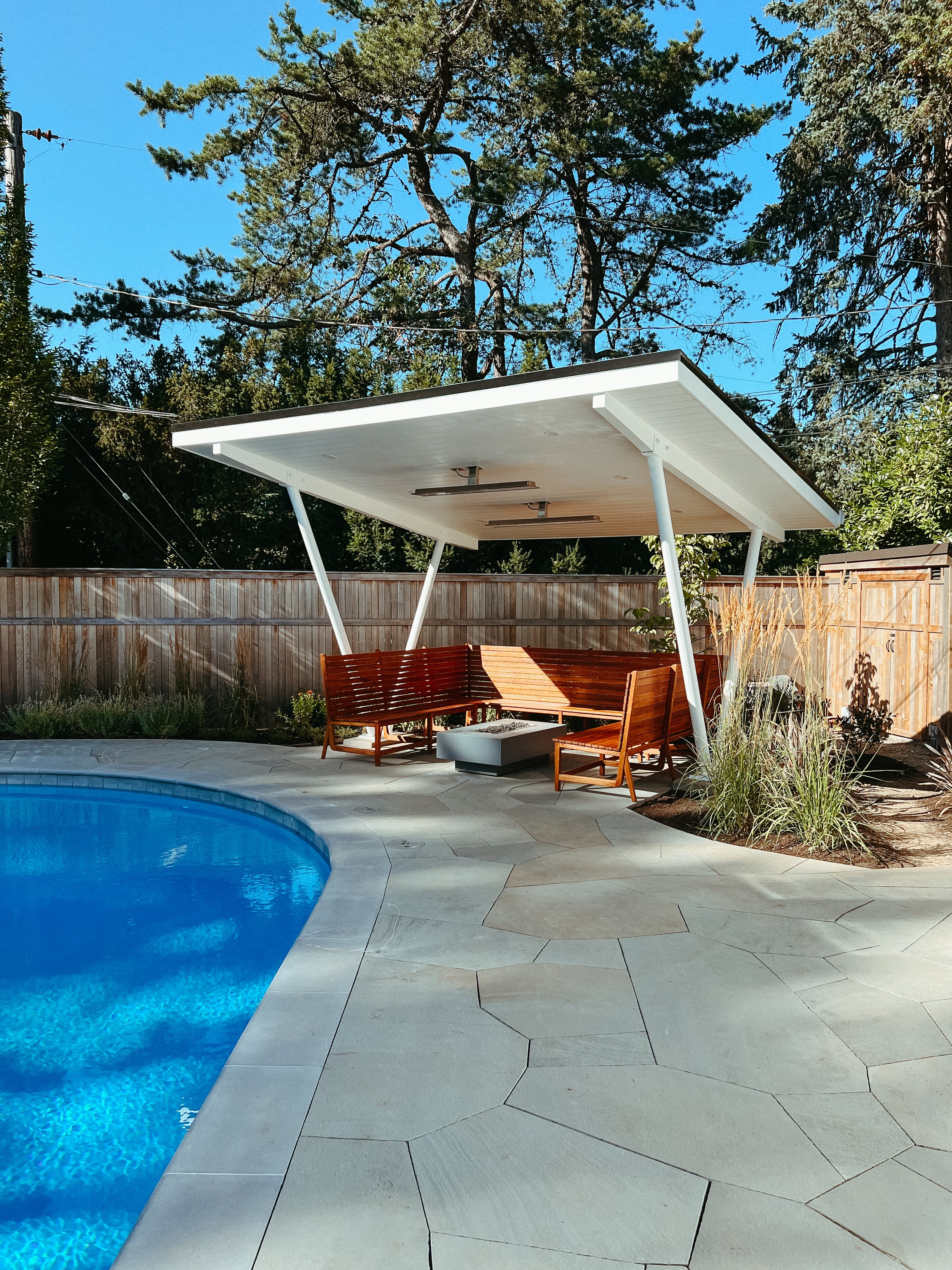 poolside pergola blue stone custom teak bench finish carpentry