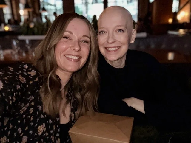 Two women with hair loss- one wearing a wig and one with a bald head