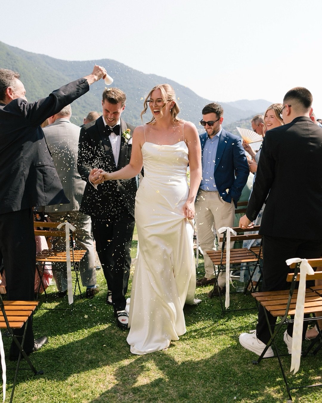 A postcard from Italy: A lakeside ceremony beneath the mountains, a boat drifting across turquoise water, sunshine on silk, long tables set for an al fresco dinner, and the people you love gathered around for every moment.

Paige &amp; Jonathan&rsquo