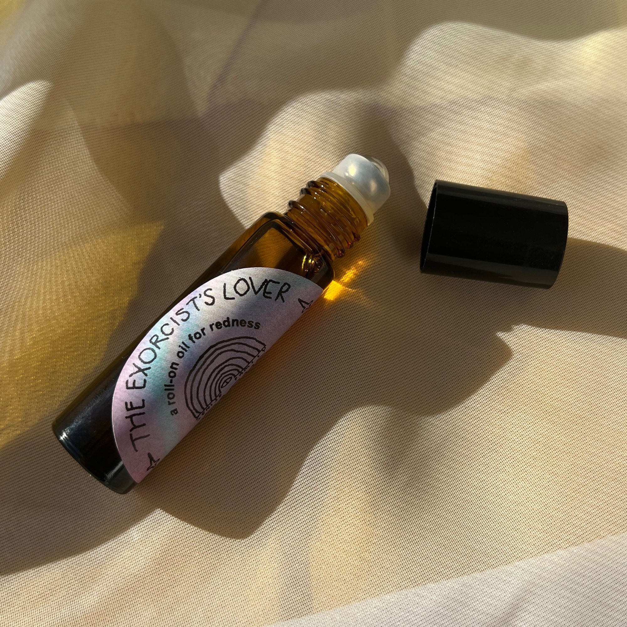 senise family farms 10ml amber roller ball with feverfew, peony, daisy and rosehip in organic extra virgin olive oil and organic vitamin e to form a natural and gentle skin ally. The exorcist's lover