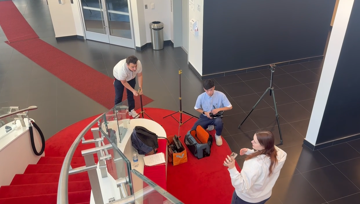 Ian, Matt, and Jennifer setting up 3.png
