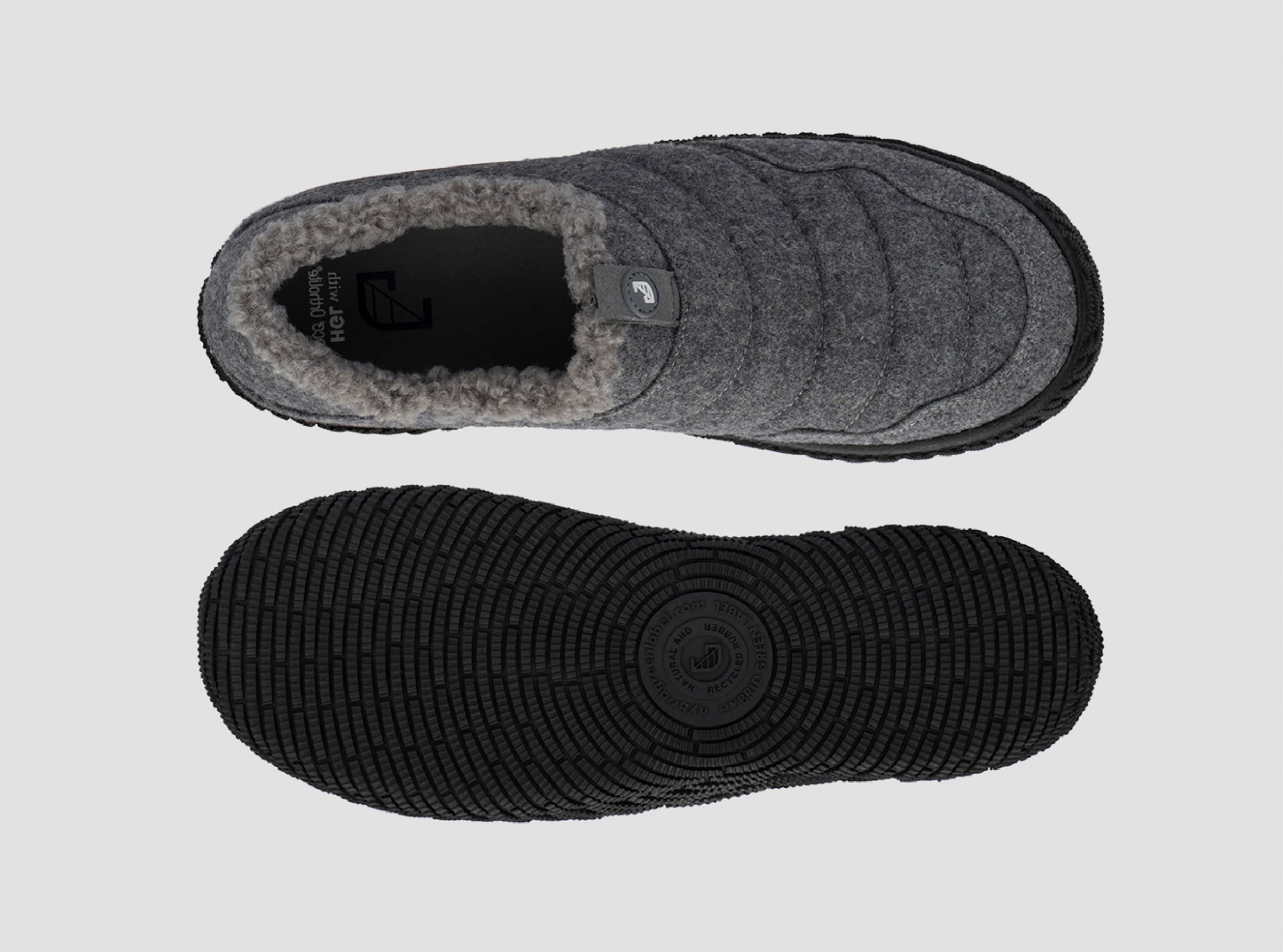 Top view of a gray, quilted, insulated slip-on shoe with fleece lining, and the bottom view displaying a black textured rubber sole with a circular logo at the center.