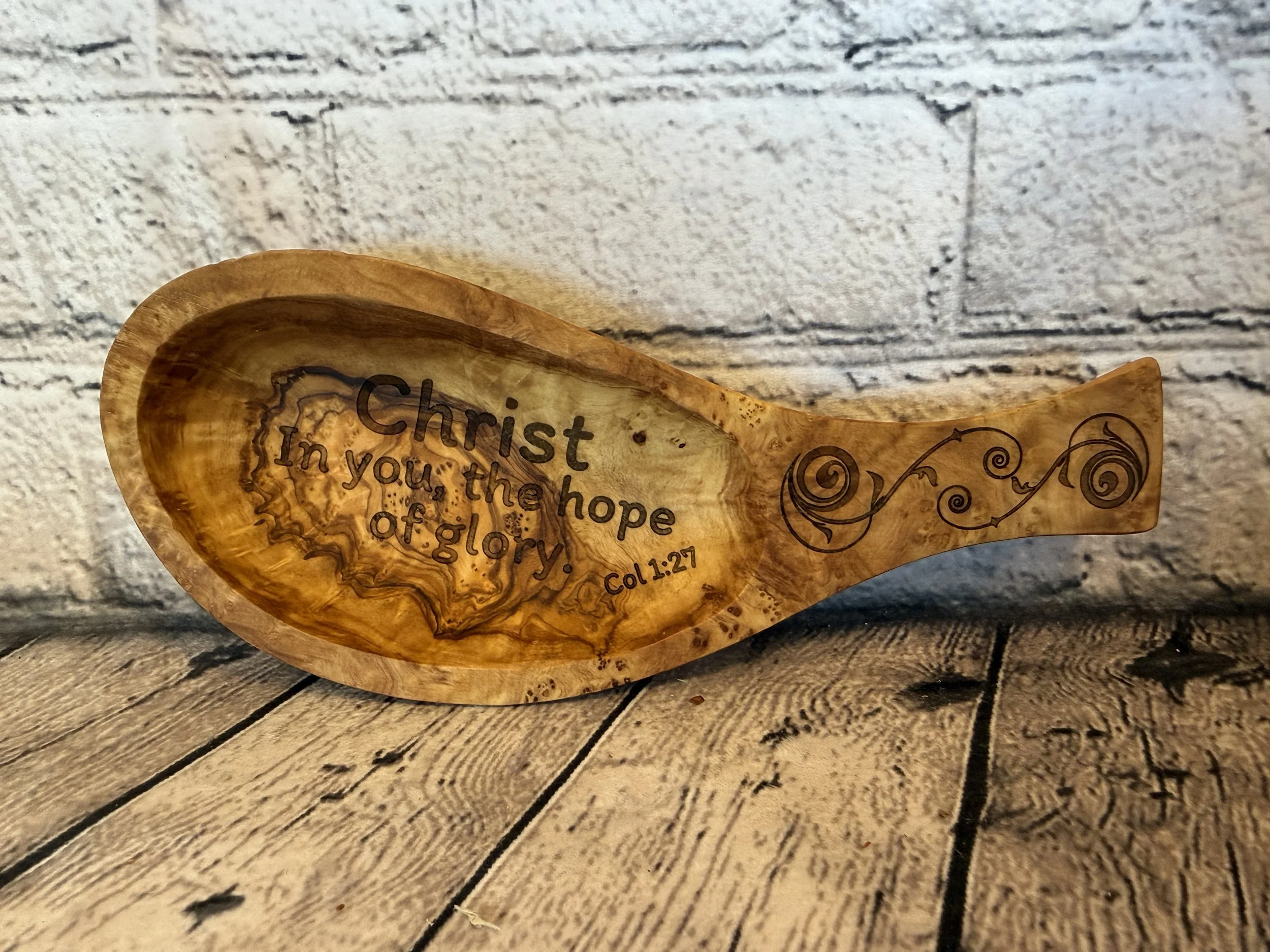 Small Olivewood spoons with various faith themes engraved on them