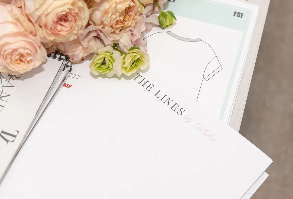 The Lines by Natalia branded client materials and apparel design sketches from a consulting session