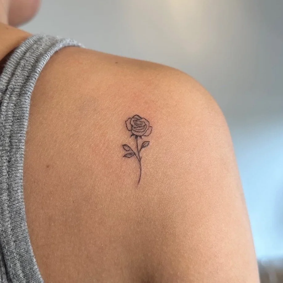 Small rose tattoo on shoulder in Los Angeles