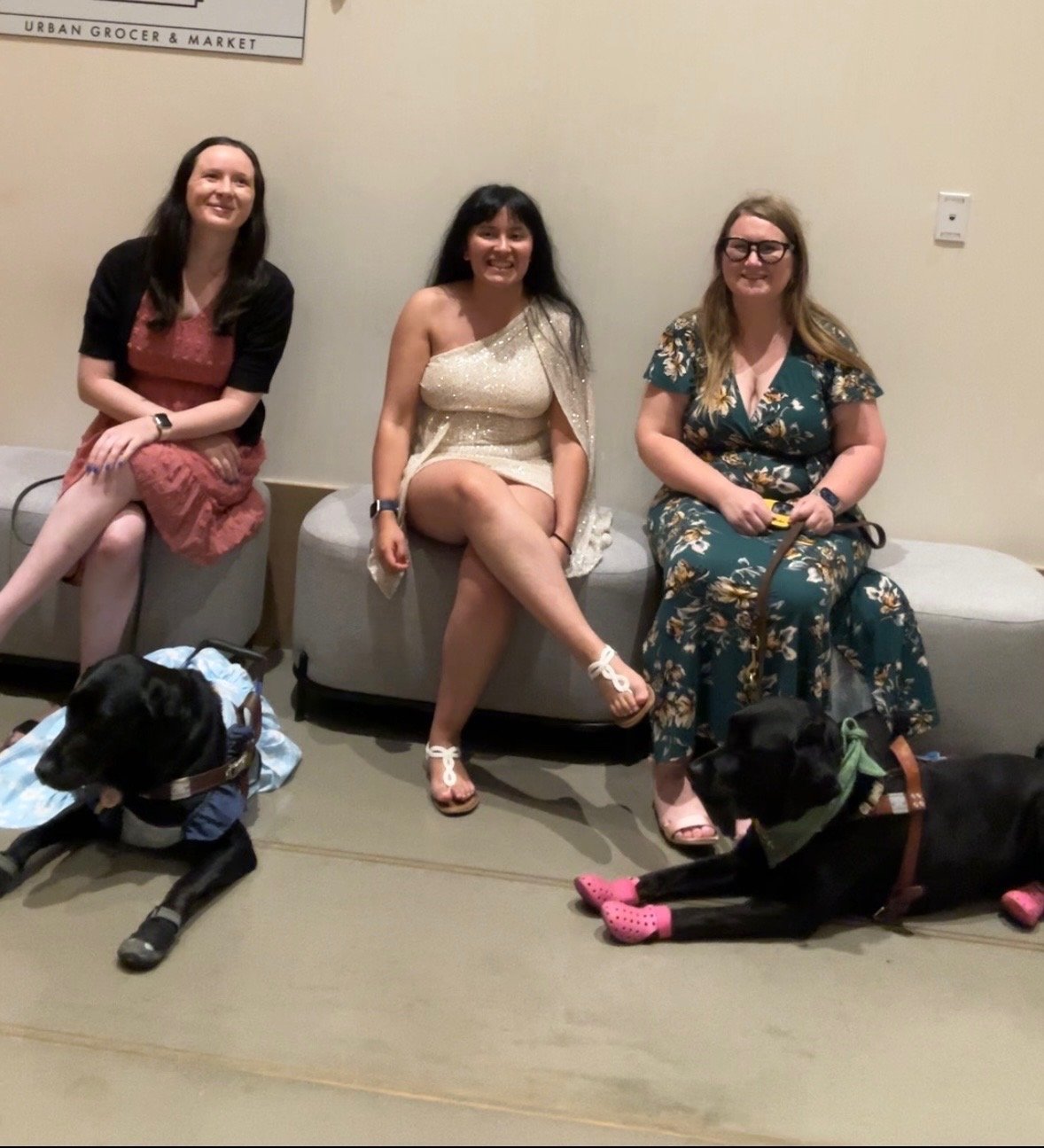 Shelbi, Lina and Lindsay sitting together with Kristen and Eve at their feet after the National Federation of the Blind Banquet