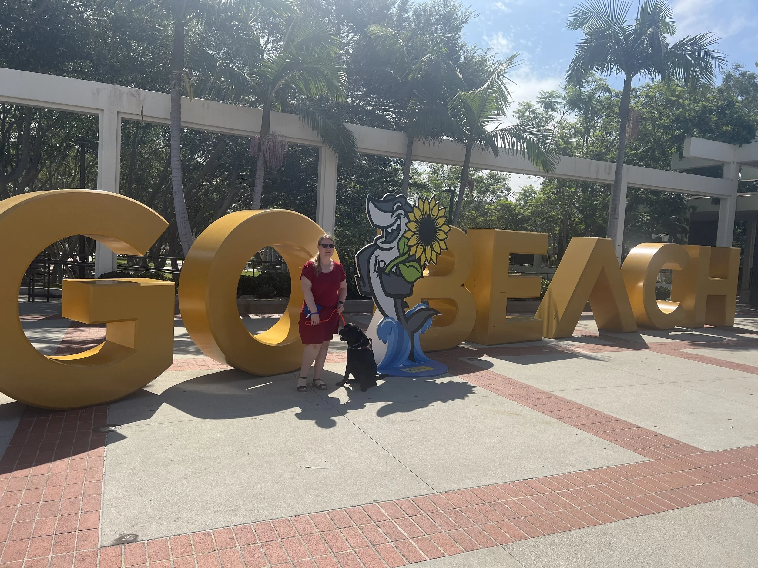 Lindsay and Eve in front of the CSULB GO Beach sign early in their partnership.