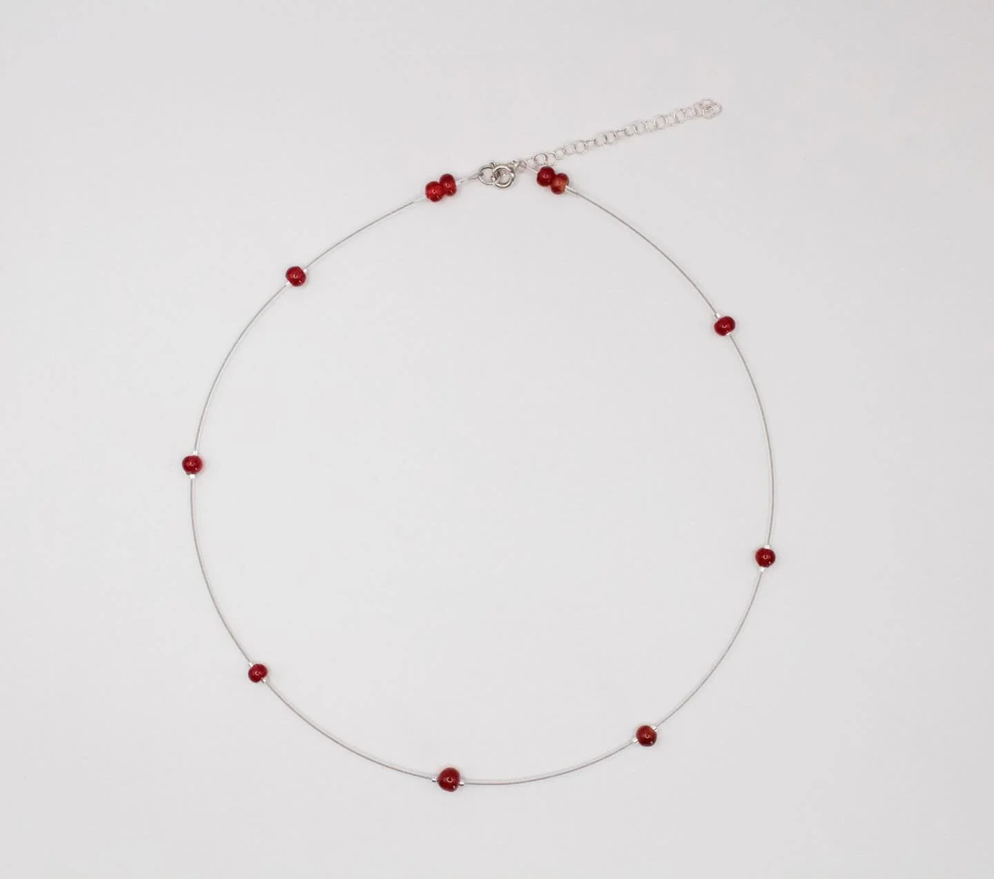 Number 06 from the Lili collection features red glass beads, each uniquely crafted. 

Available on the website now ✦
