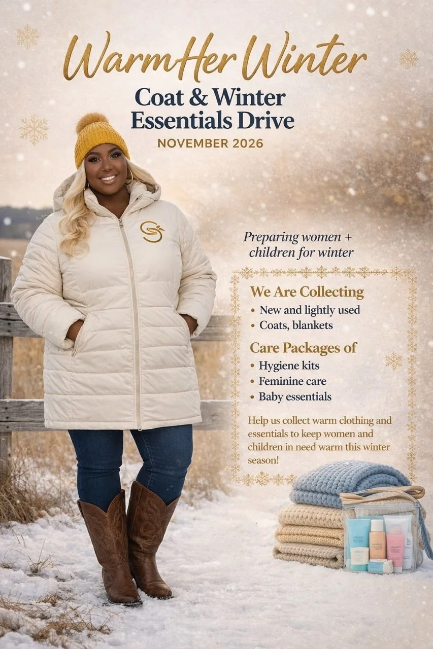 A woman standing outdoors in snow, wearing a white winter coat, brown cowboy boots, blue jeans, and a yellow knit hat. The background includes a wooden fence and snow-covered ground. Text on the image promotes a coat and winter essentials drive for November 2026, collecting lightly used coats, blankets, hygiene kits, feminine care, and baby essentials to help women and children in need during winter.