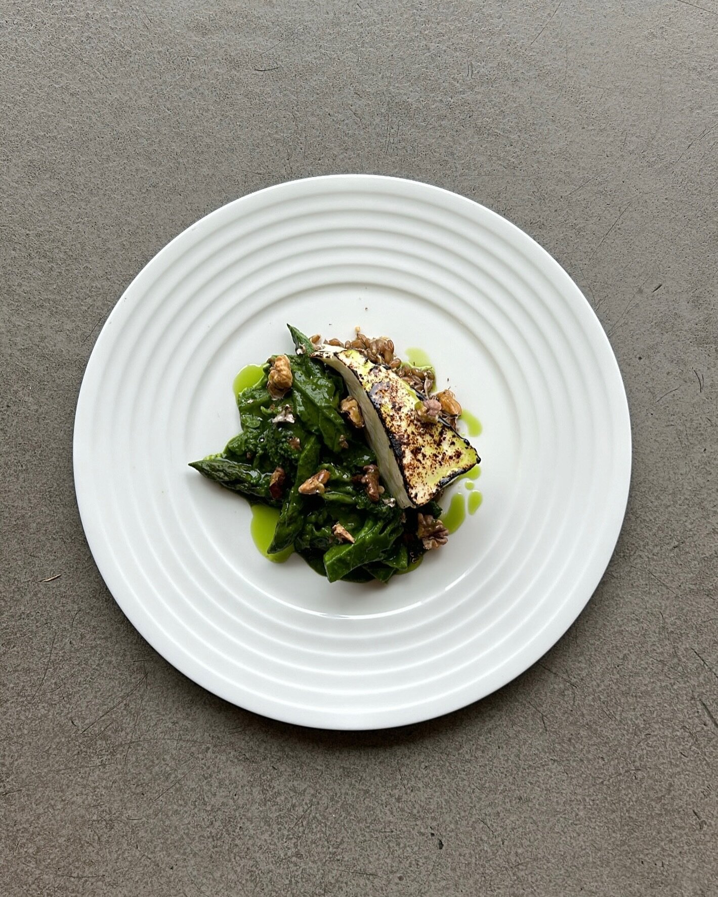 Grilled Feta from @erdhof. Braised Rye. Green Asparagus. Walnuts. Wild Garlic Oil.