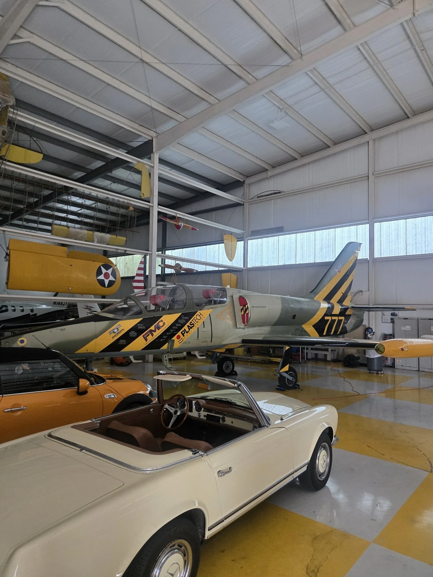 Warbirds hanging in the hangar at McCollum Field the day before the show