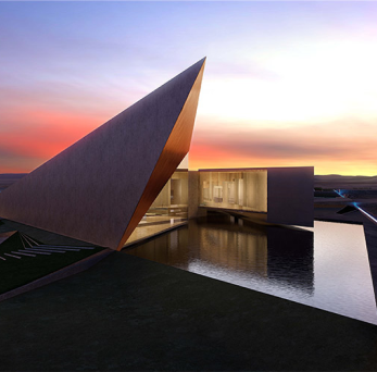 Modern building with sharp angular roof, situated near water during sunset.