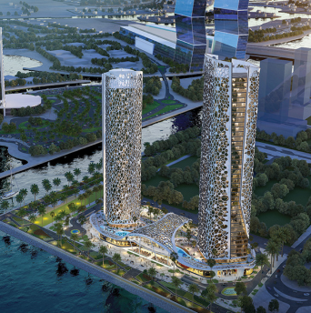 Aerial view of two modern skyscrapers with unique honeycomb patterned facades, situated along a waterfront with green parks, roads, and nearby buildings in an urban area.