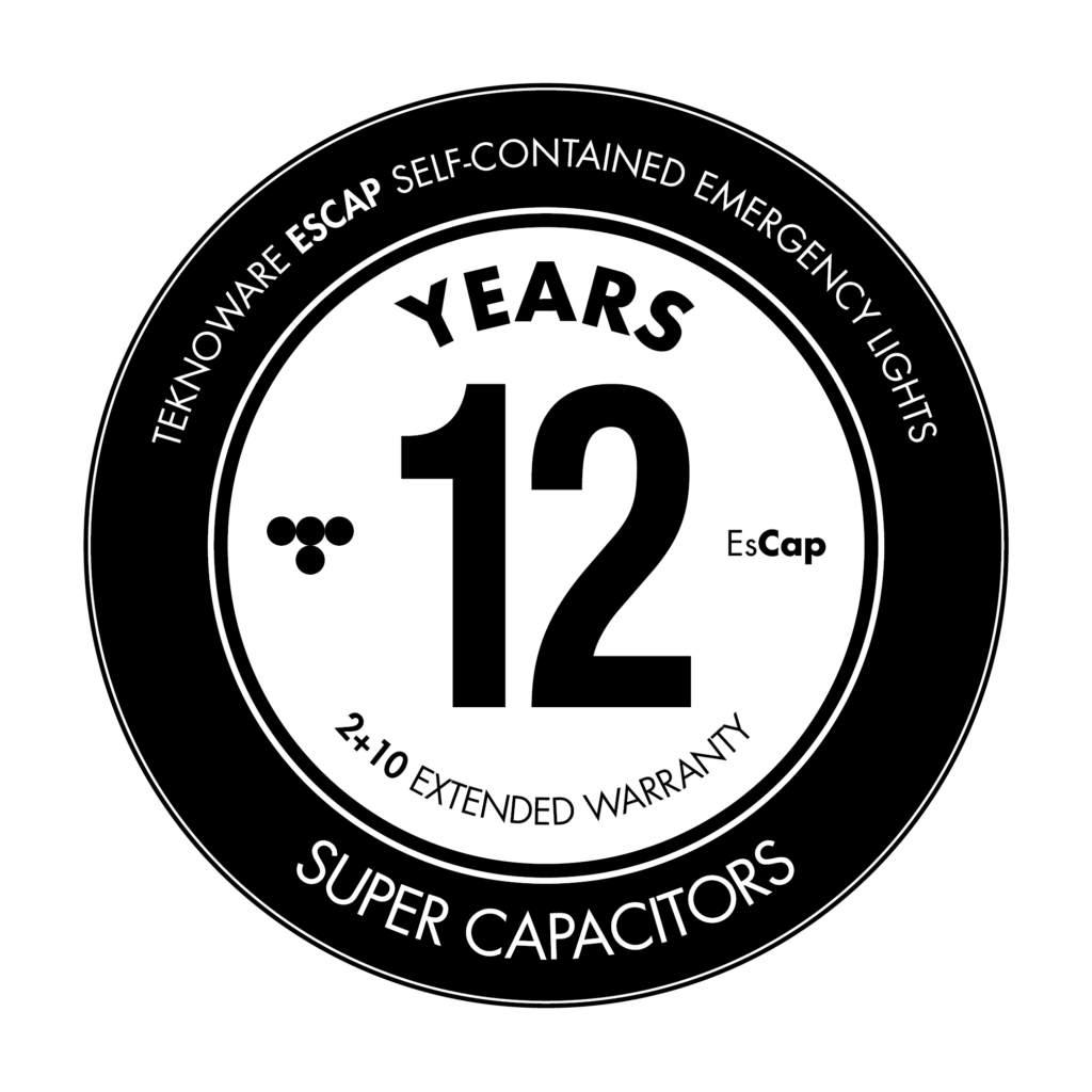 Black and white circular badge celebrating 12 years of Teknoware ESCAP Super Capacitors, with text indicating a 2 plus 10 extended warranty and self-contained emergency lights.