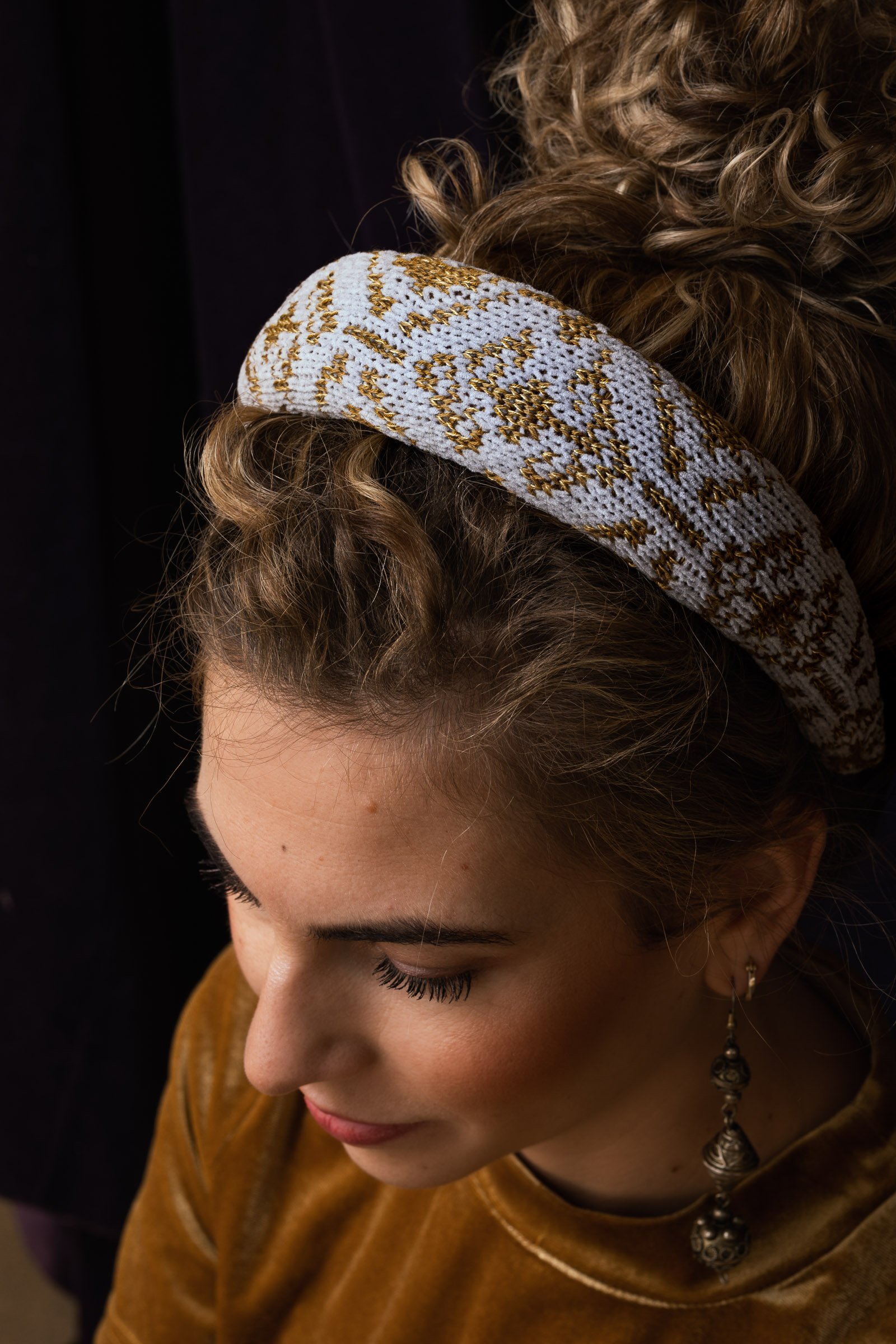 Handmade refined puffy headband, covered with decorative knit of grey velvet yarn and golden Merino wool blend