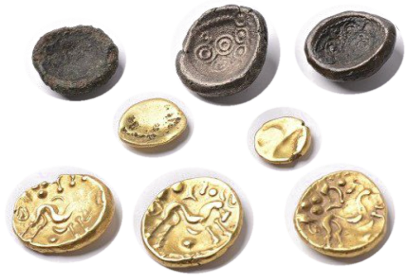 A selection of ancient Celtic bronze and gold coins found near Thorn, showing their organic shapes and handcrafted details.