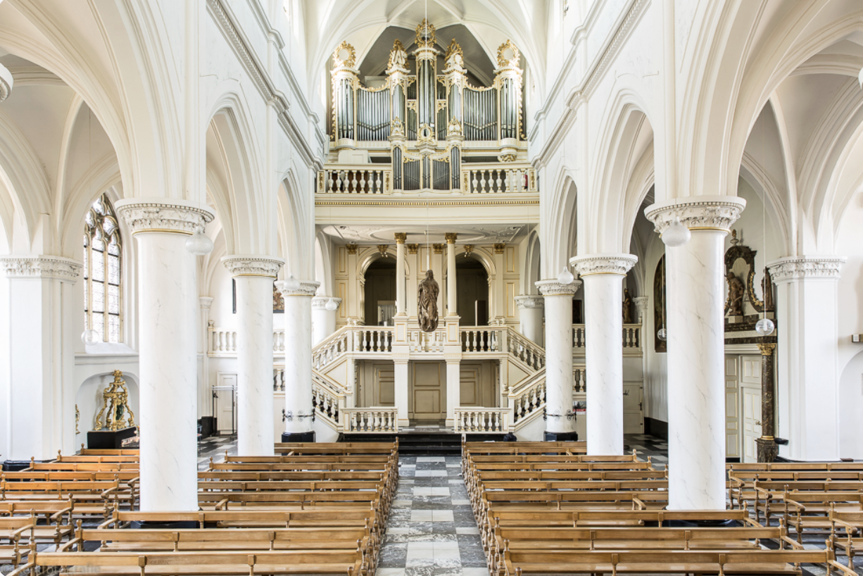 Interior of Thorn’s Abbey Church, showing the nave, marble columns and historic organ.