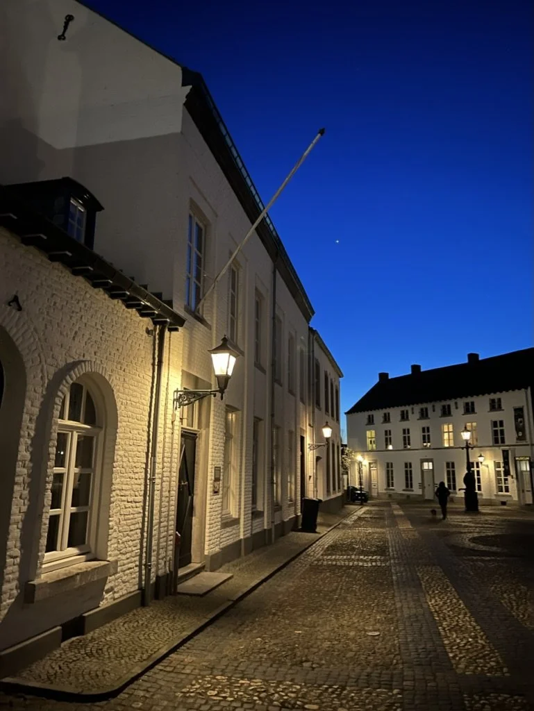 illuminated-white-houses-cobbled-street-thorn-evening.jpg