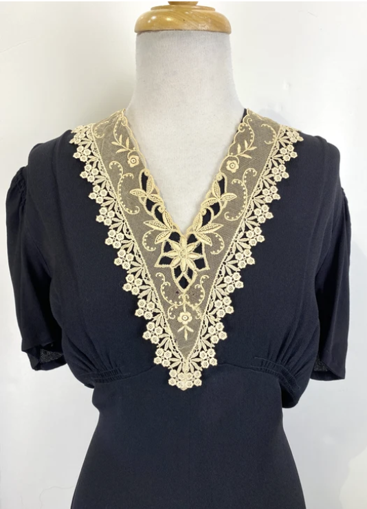 1930s Fashion — Black Dress with Ornamental Lace Neckline