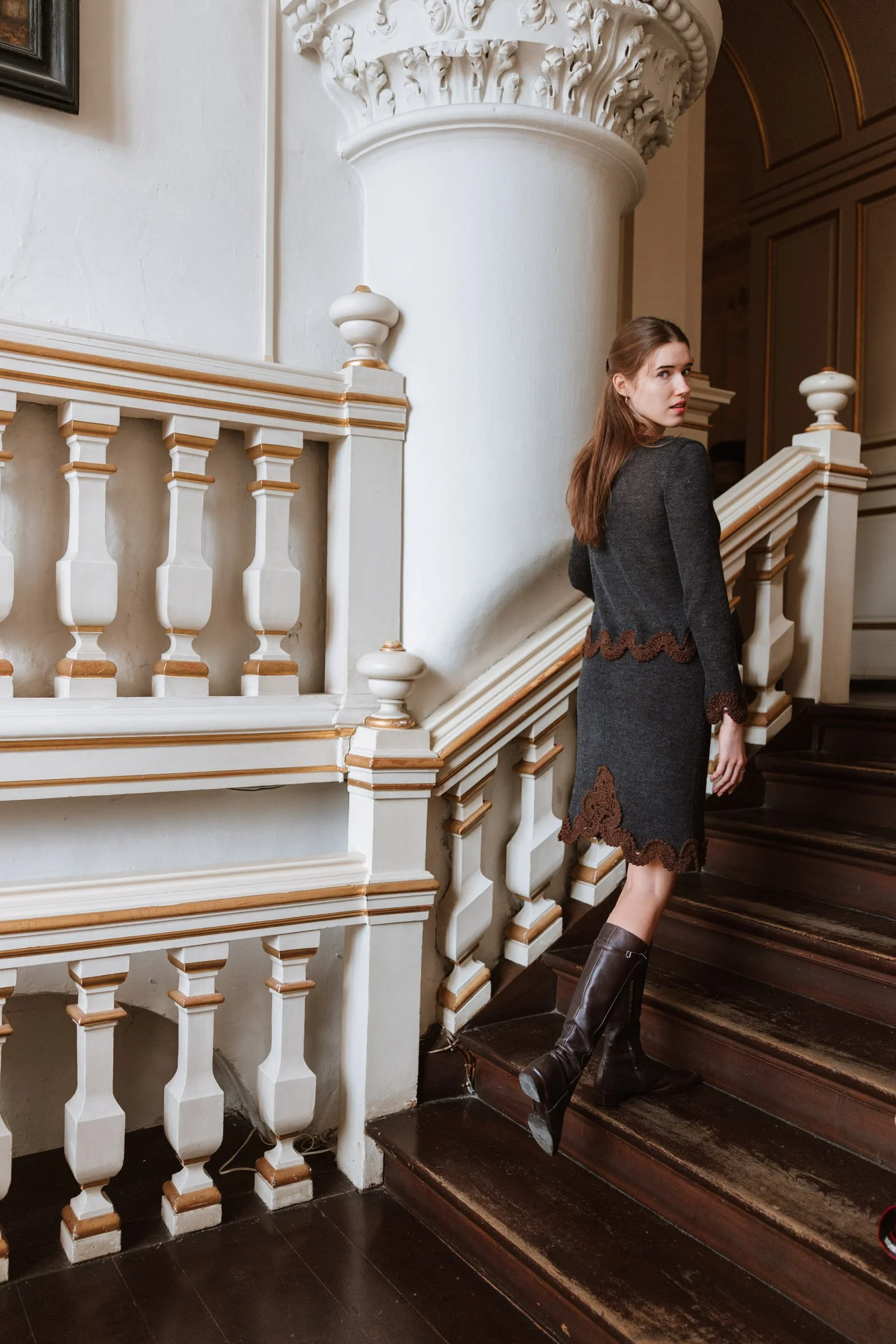 Studio Myr BAROQUE – Side view of the Francisca skirt in charcoal grey Merino wool with chocolate brown lace, worn with a matching jacket