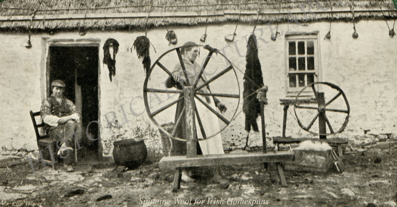 Spinning wool for Irish homespun outside a rural cottage in early 20th-century Ireland