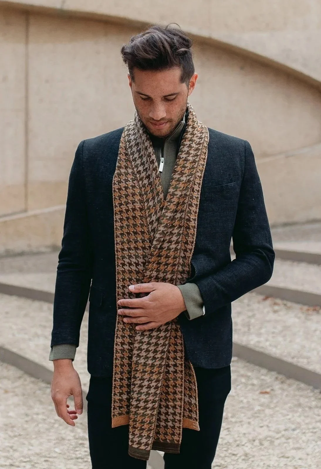 Studio Myr Houndstooth scarf for men, double-knit jacquard in houndstooth pattern, worn with a contemporary tailored jacket.