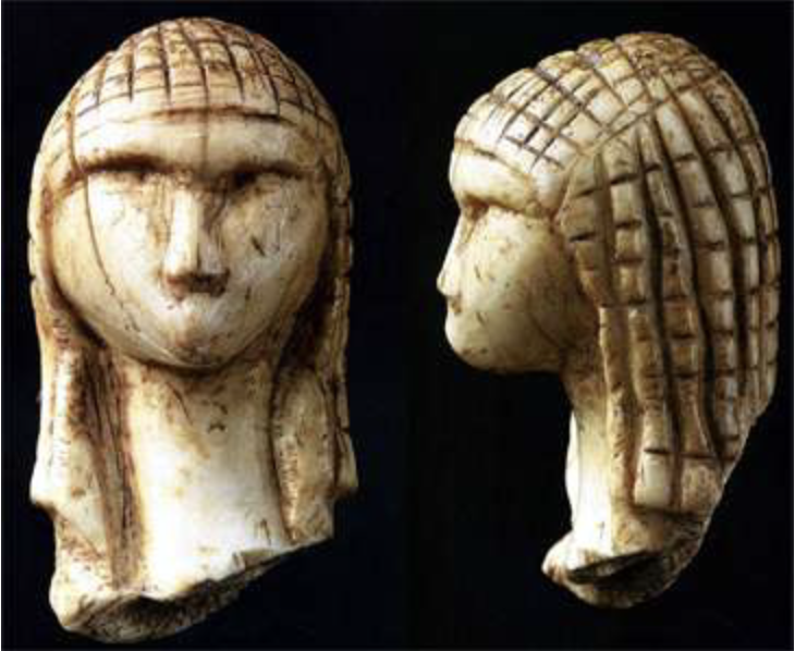 Venus of Brassempouy figurine showing prehistoric braided head covering — one of the earliest representations of women styling their hair with textile-like nets.