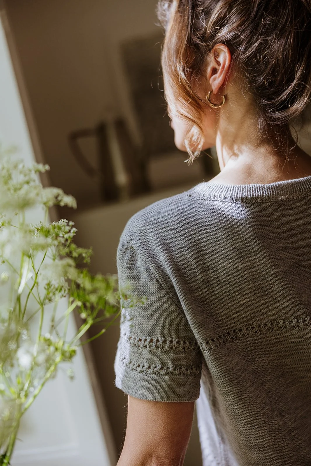 Back view of Studio Myr Merino Lace Knit Tee in natural Mouse grey Merino wool