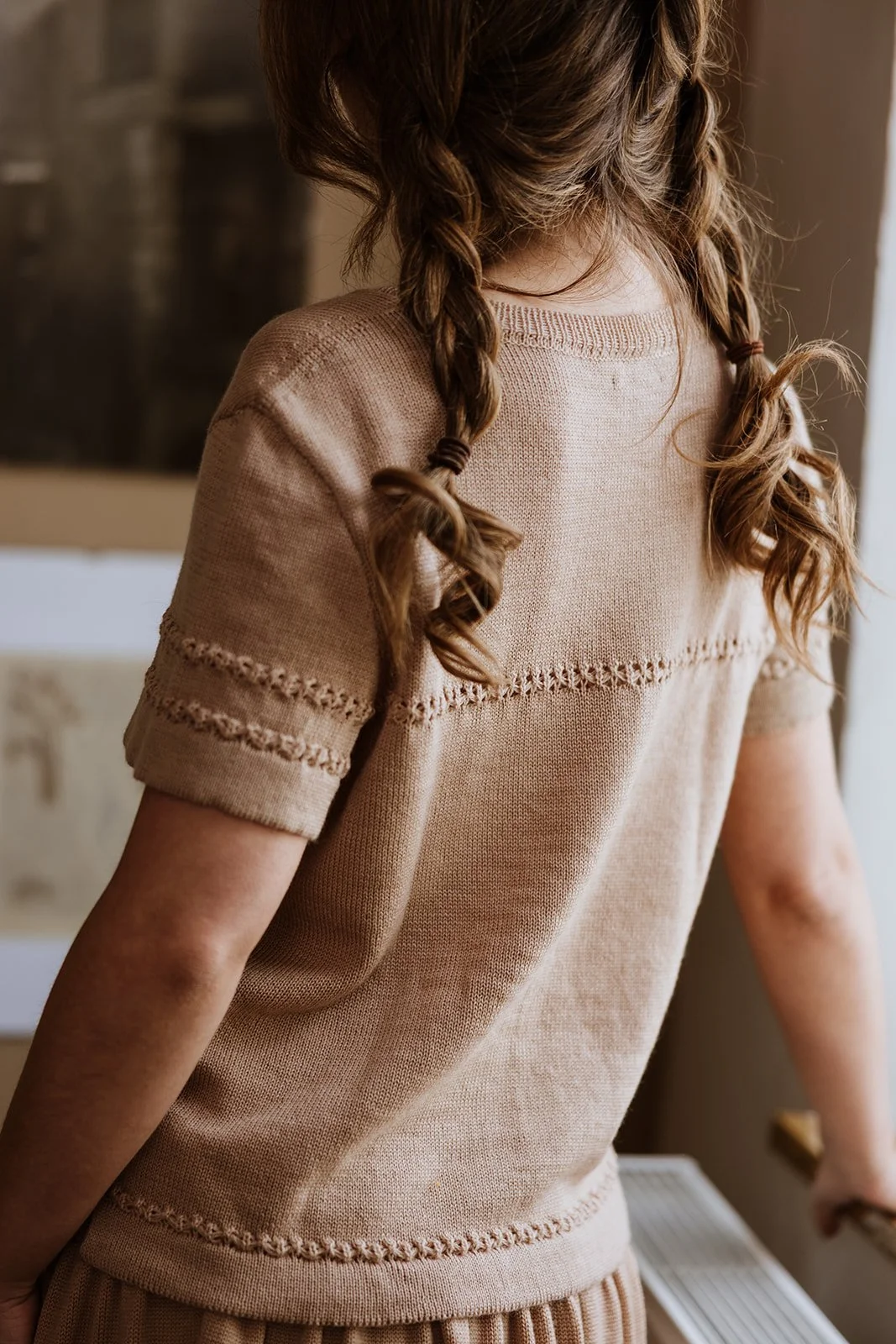 Soft side view of Studio Myr Merino Lace Knit Tee in Honey extra fine Merino wool