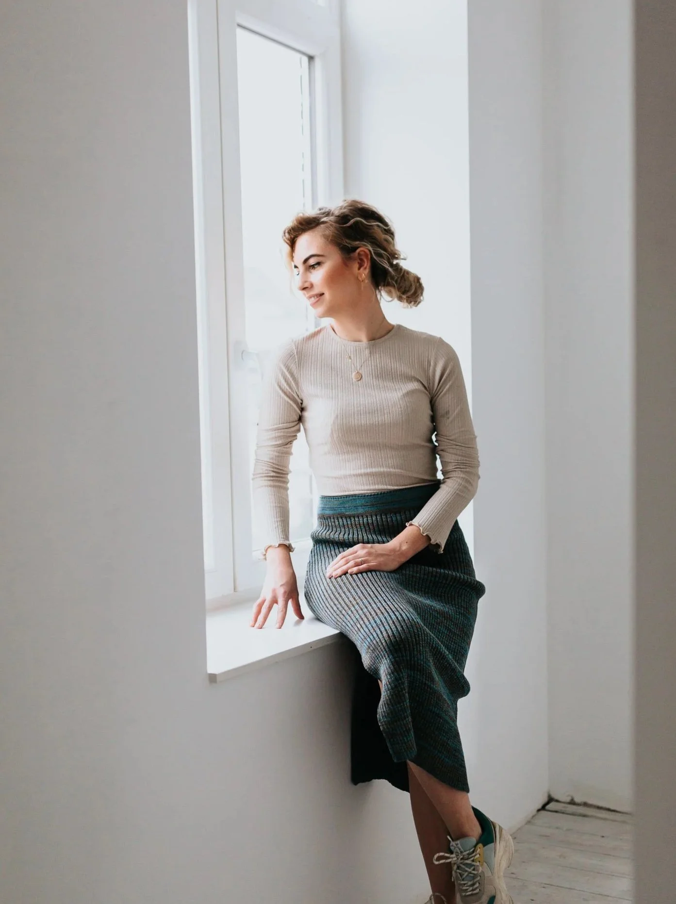 Rib knit midi pencil skirt with sparkles in teal blue Merino wool blend on model