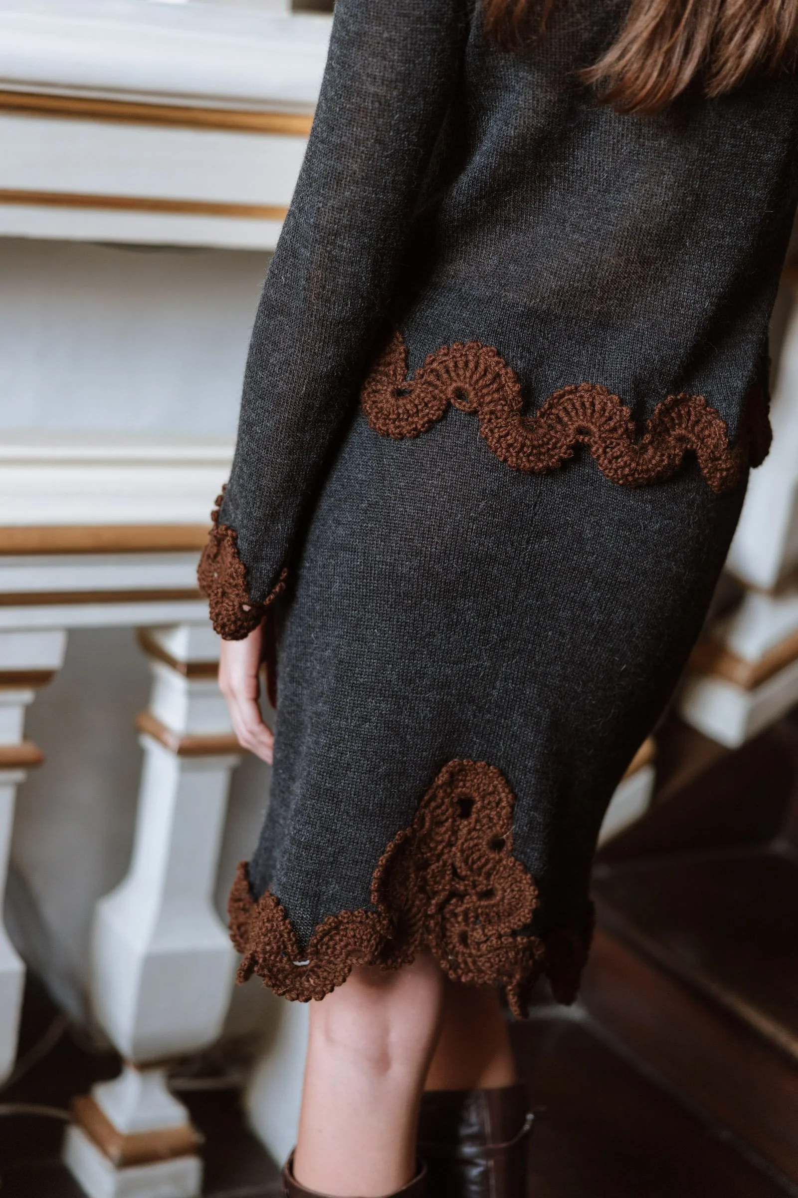 Studio Myr BAROQUE – Close-up of the Francisca skirt worn by a model, highlighting the chocolate brown hand-crocheted lace around the back slit