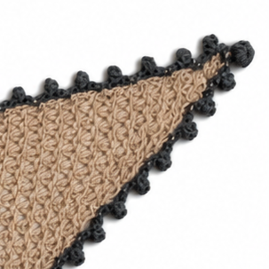 Close-up of the Gabriella scarf in beige Extra Fine Merino with contrasting grey hand-crocheted Baby Alpaca picot edging and decorative button closure.