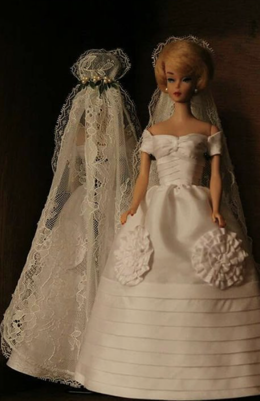 Vintage Barbie doll in an ivory couture wedding dress with lace veil, reflecting early influences of elegance, craftsmanship and feminine silhouettes in Studio Myr designs